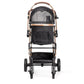 Dogline Signature Legacy dog stroller frame showing shock-absorbing 4-wheel system — rose gold