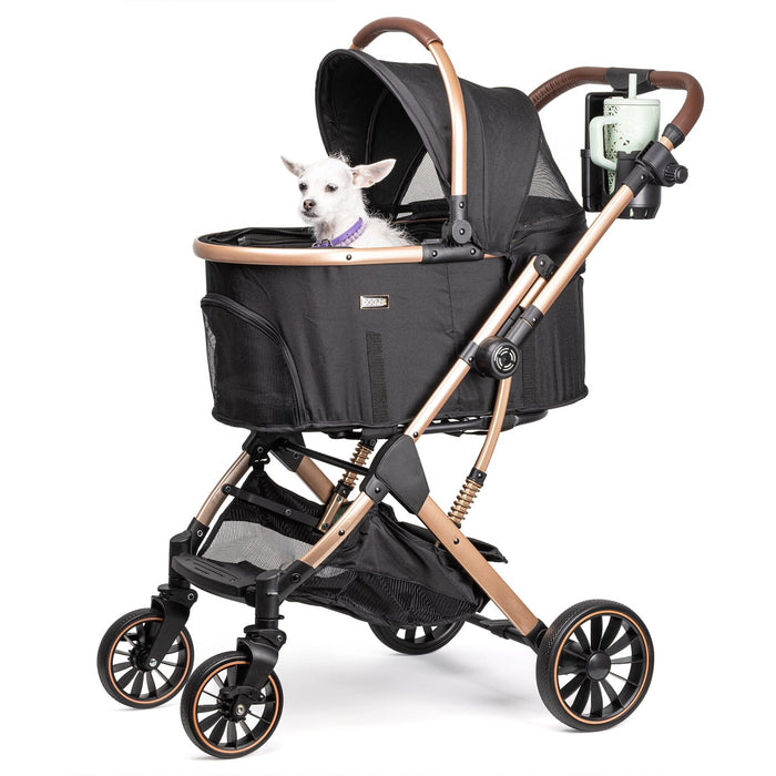 Small white chihuahua in Dogline Signature Legacy black dog stroller with rose gold frame and cup holder