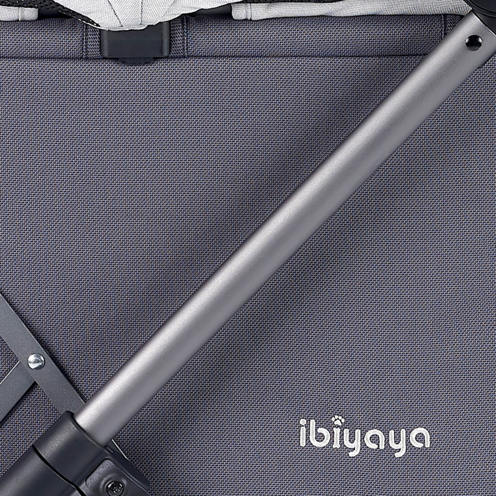 Close-up of a gray pet stroller with 'ibiyaya' branding 