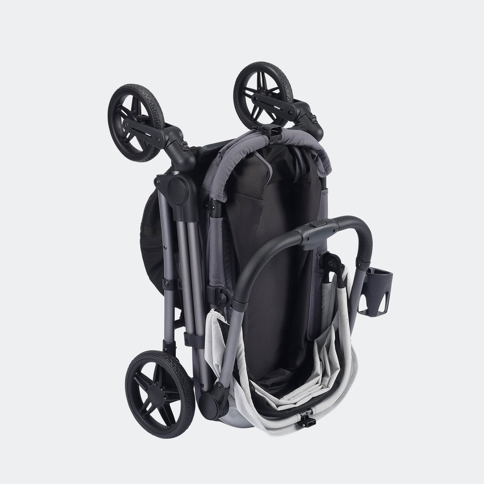 Gray and white pet stroller by Ibiyaya Maxi shown folded for storage
