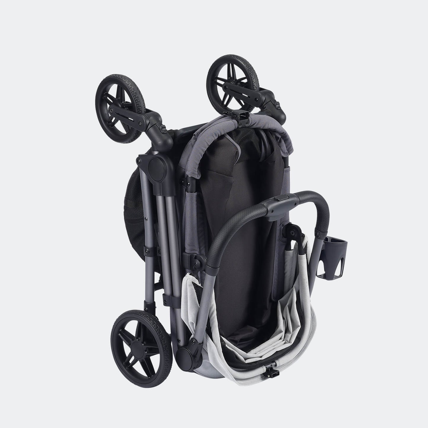 Gray and white pet stroller by Ibiyaya Maxi shown folded for storage