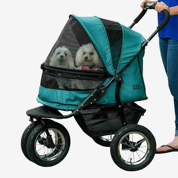 Two dogs riding inside Pet Gear Double Dog Stroller for large dogs. Closed canopy.