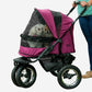 Two dogs riding inside Pet Gear Double Dog Stroller for large dogs.