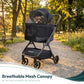 WonderFold Bella Pet stroller with breathable mesh canopy in a park setting