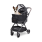 Dog in a black WonderFold Bella pet stroller on a white background