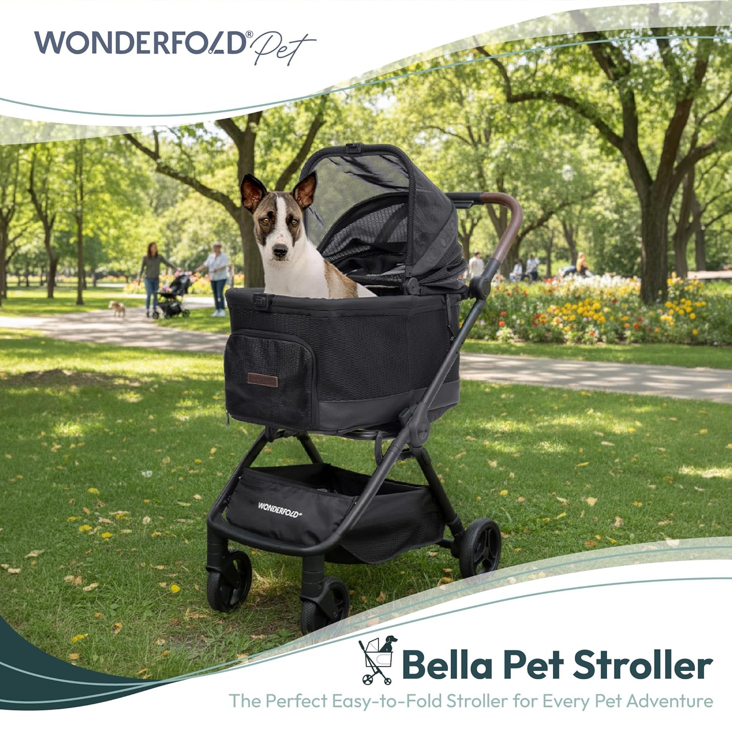 Dog in a black WonderFold pet stroller with in a park setting.