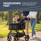 Couple walking Shiba Inu dog in WonderFold Buddy pet stroller at park — lightweight foldable dog stroller
